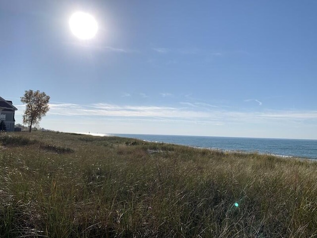 view of landscape with a water view