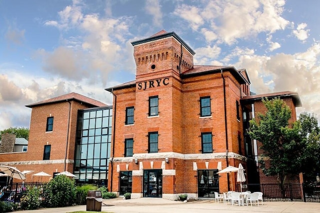 view of building exterior featuring fence