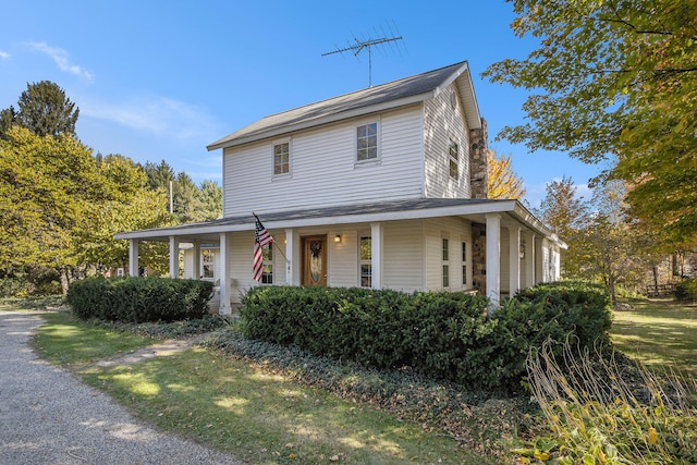 country-style home with covered porch