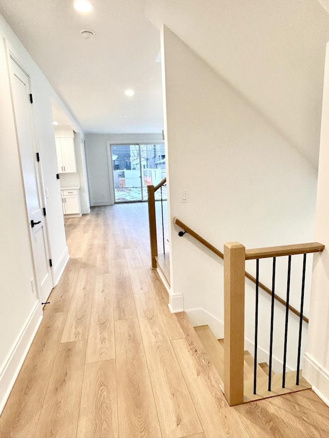 hall with light hardwood / wood-style floors