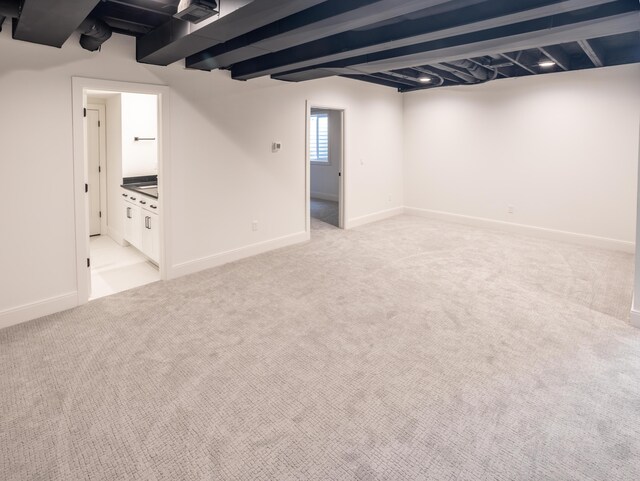 basement with light colored carpet