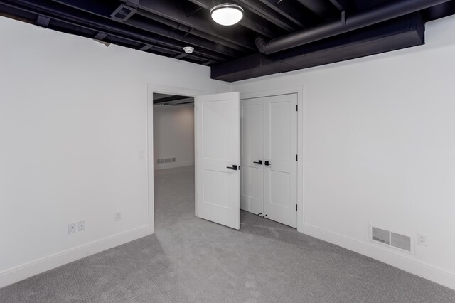 basement with light colored carpet