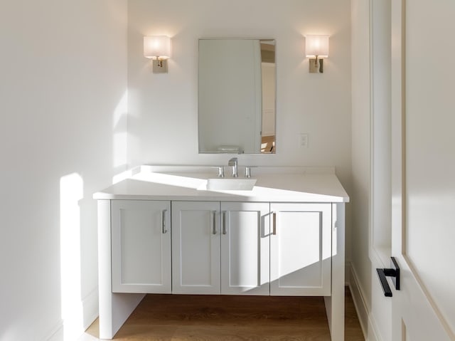 bathroom featuring hardwood / wood-style floors and vanity