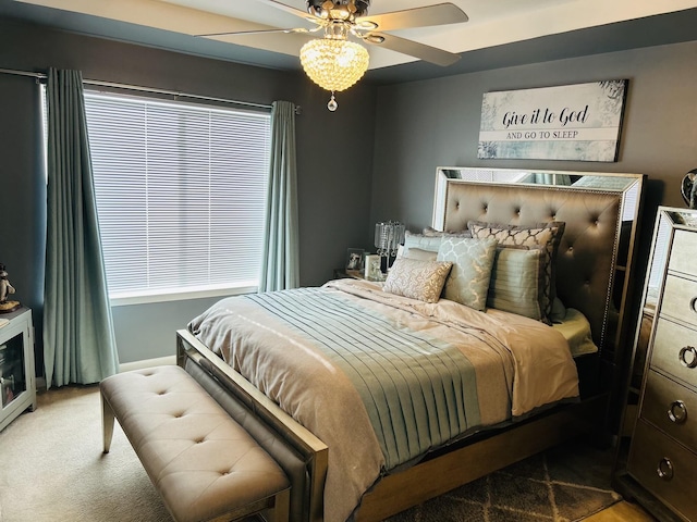 bedroom featuring carpet flooring, multiple windows, and ceiling fan