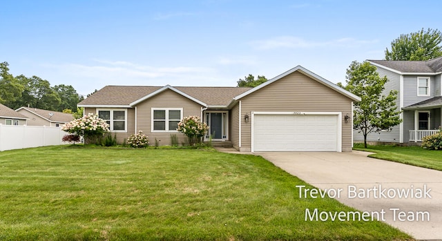 view of front of home with a front lawn and a garage