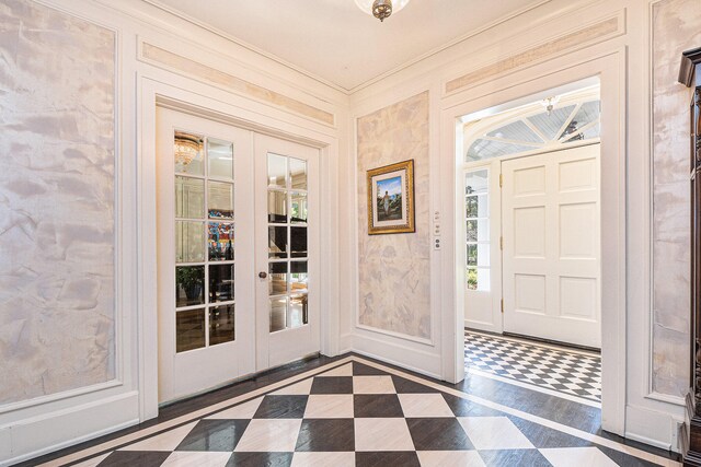 foyer entrance with french doors and crown molding