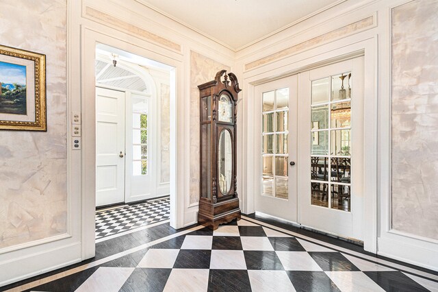 interior space featuring french doors and ornamental molding