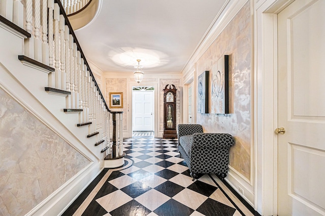 entrance foyer featuring ornamental molding