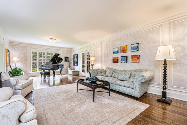 living room featuring ornamental molding and hardwood / wood-style flooring