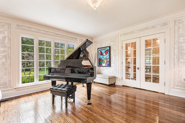 misc room with french doors, wood-type flooring, and ornamental molding