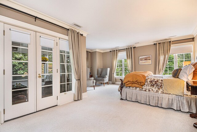 carpeted bedroom with access to outside, french doors, and ornamental molding