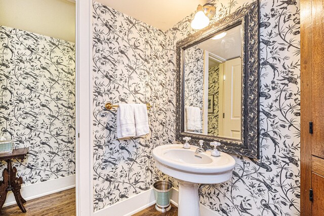 bathroom with wood-type flooring