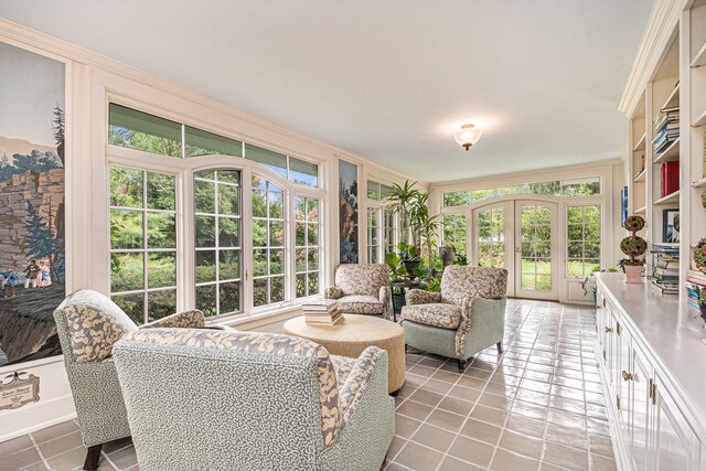 sunroom featuring french doors and a healthy amount of sunlight