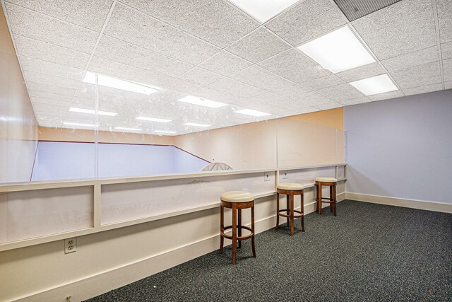 bar featuring a paneled ceiling