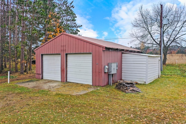 garage with a lawn