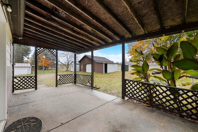 view of patio with a storage shed