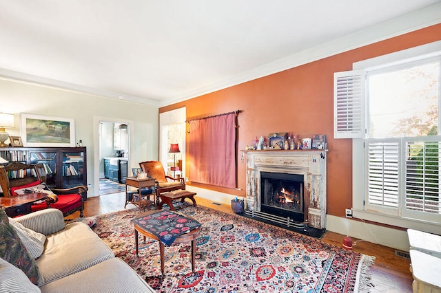 living room featuring ornamental molding and hardwood / wood-style floors