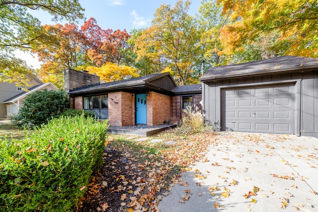 ranch-style home featuring a garage