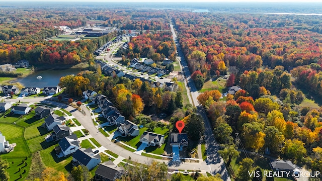 bird's eye view with a water view