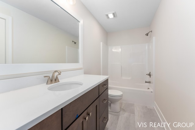 full bathroom featuring vanity, toilet, and shower / tub combination