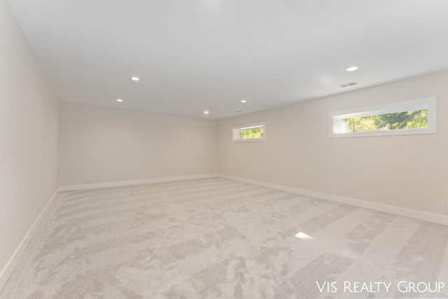 empty room with light colored carpet