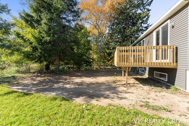 view of yard with a wooden deck