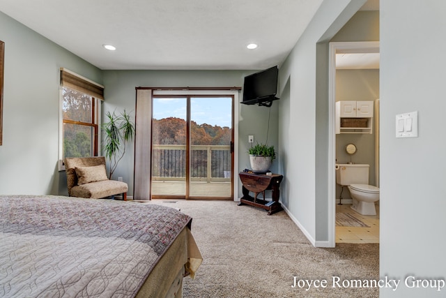 carpeted bedroom featuring connected bathroom and access to outside