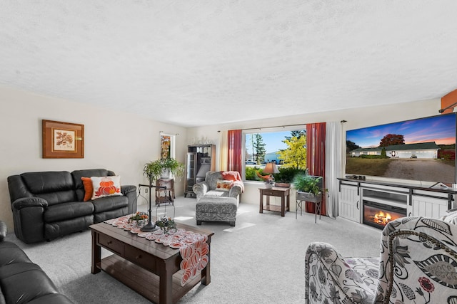 living room with a textured ceiling and light colored carpet