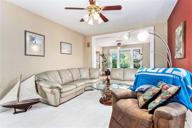 living room featuring carpet flooring and ceiling fan