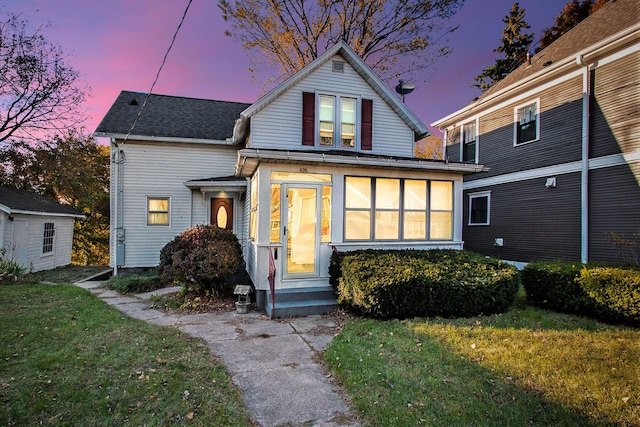 view of front of property with a lawn