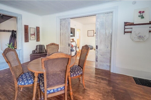 dining area with dark wood-type flooring