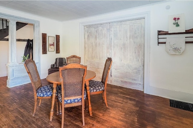 dining area featuring dark hardwood / wood-style floors