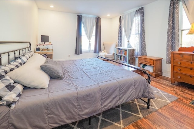 bedroom with hardwood / wood-style floors