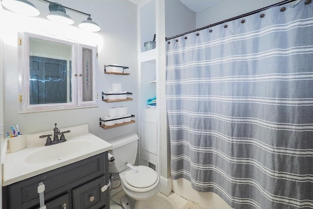 bathroom featuring vanity, a shower with shower curtain, and toilet