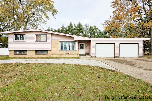 view of front facade with a garage and a front lawn