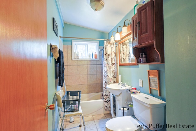 bathroom featuring lofted ceiling, shower / tub combo with curtain, toilet, and tile patterned flooring