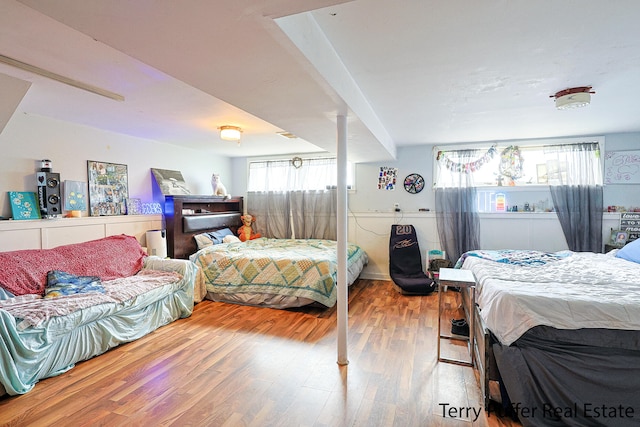 bedroom with hardwood / wood-style flooring