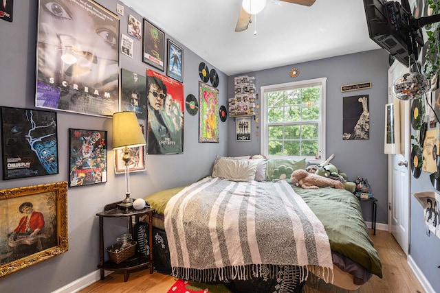 bedroom featuring hardwood / wood-style flooring and ceiling fan