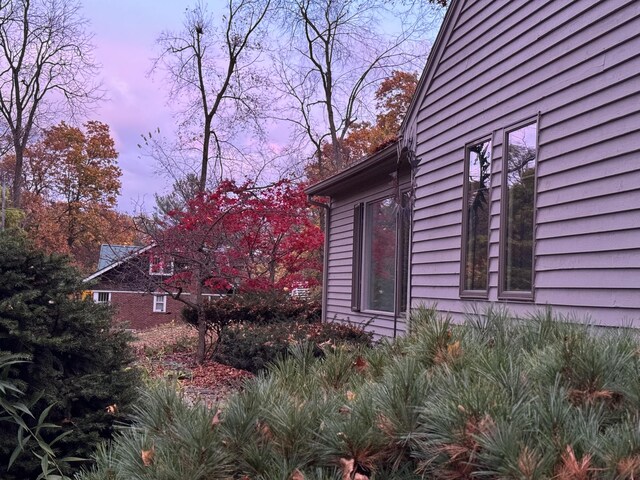 view of property exterior at dusk