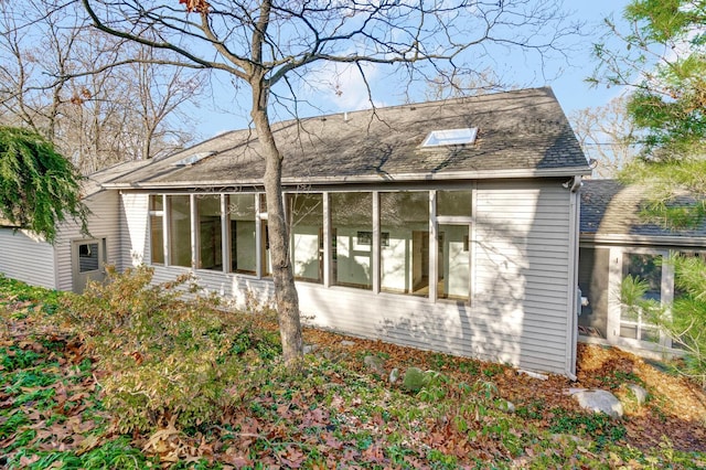 back of property featuring a sunroom