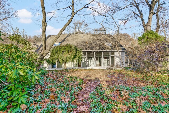 view of front of home with a sunroom