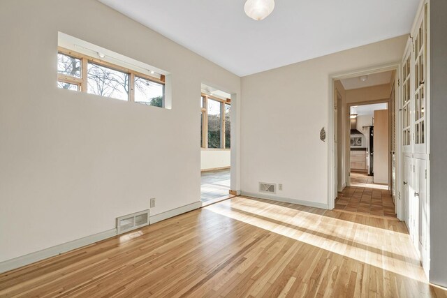 unfurnished room featuring light hardwood / wood-style flooring