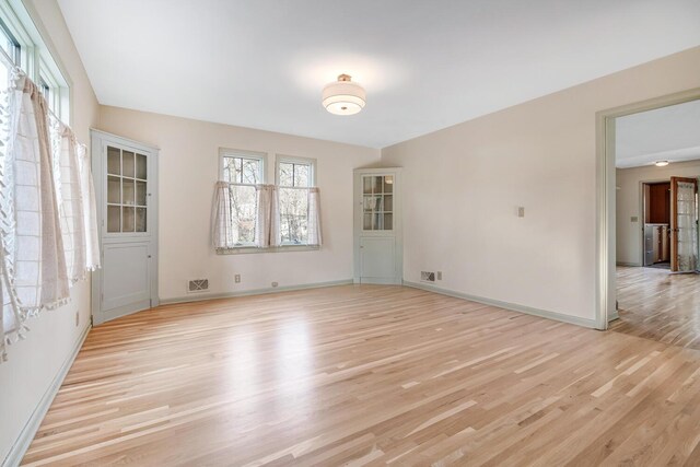 empty room with light wood-type flooring