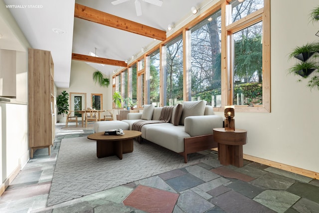 sunroom / solarium with lofted ceiling with beams and ceiling fan