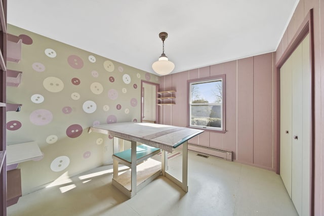 dining area featuring a baseboard heating unit