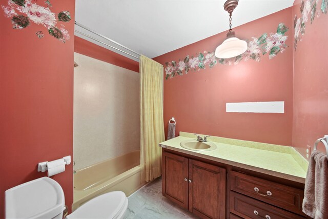 full bathroom with vanity, shower / tub combo with curtain, and toilet