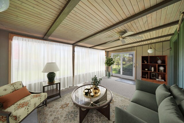 living room featuring vaulted ceiling with beams, carpet floors, wooden ceiling, and ceiling fan