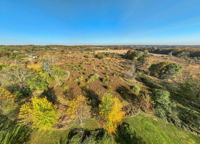 birds eye view of property featuring a rural view