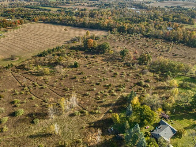 birds eye view of property with a rural view