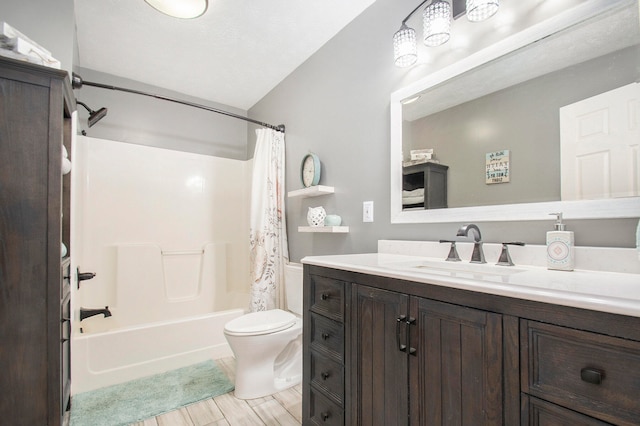 full bathroom featuring hardwood / wood-style floors, toilet, vaulted ceiling, vanity, and shower / bathtub combination with curtain